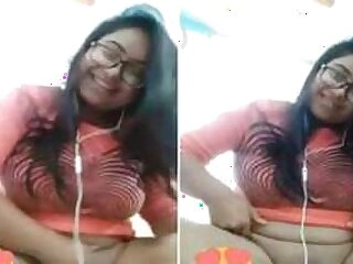 Sneering Indian girl with glasses