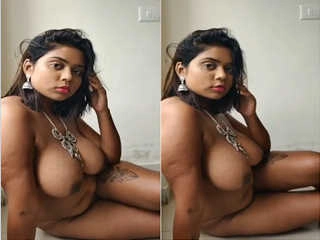 Busty model flaunts her figure in a hot