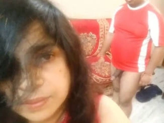A middle-aged Indian duo engages in